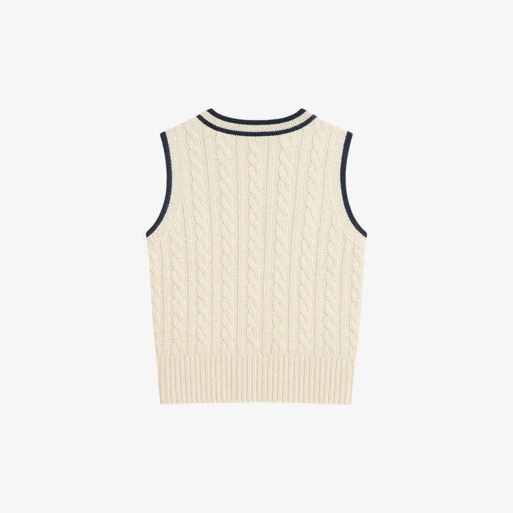 Madasty Signature Cable-Knit Vest

A timeless layering piece designed for polished, effortless style. This black cable-knit vest features crisp cream trim along the V-neck and armholes, a delicate embroidered M on the chest, and a subtle Madasty label at