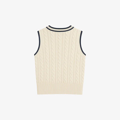 Madasty Signature Cable-Knit Vest

A timeless layering piece designed for polished, effortless style. This black cable-knit vest features crisp cream trim along the V-neck and armholes, a delicate embroidered M on the chest, and a subtle Madasty label at