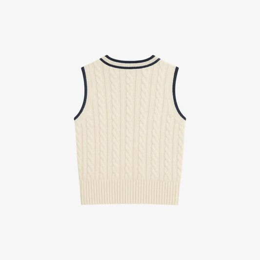 Madasty Signature Cable-Knit Vest

A timeless layering piece designed for polished, effortless style. This black cable-knit vest features crisp cream trim along the V-neck and armholes, a delicate embroidered M on the chest, and a subtle Madasty label at